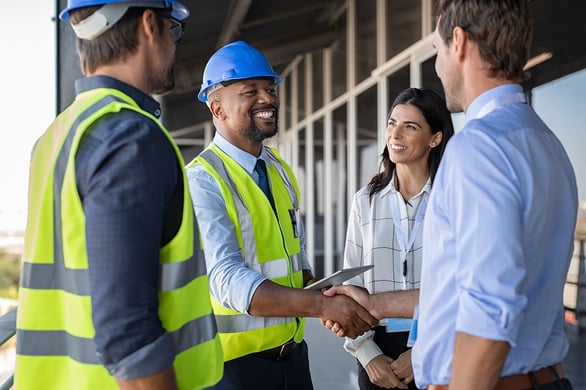 construction-project-team-handshake construction-project-team-handshake