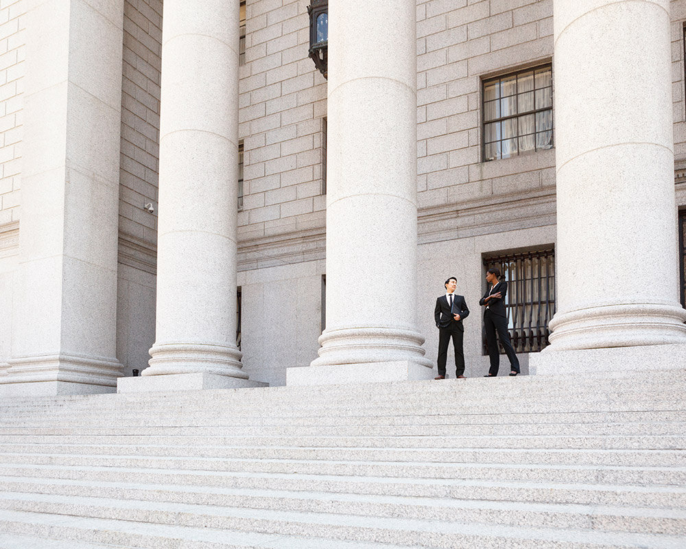 two-business-men-on-steps