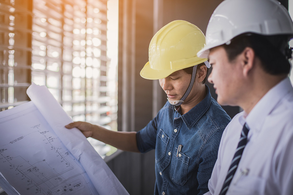 two-contractors-going-over-plans two-contractors-going-over-plans